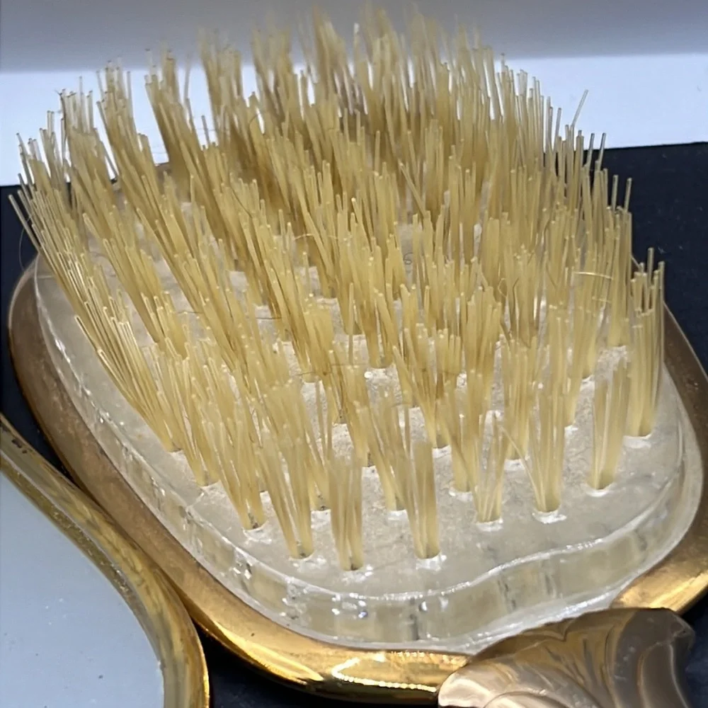 Vintage vanity hand mirror and brush